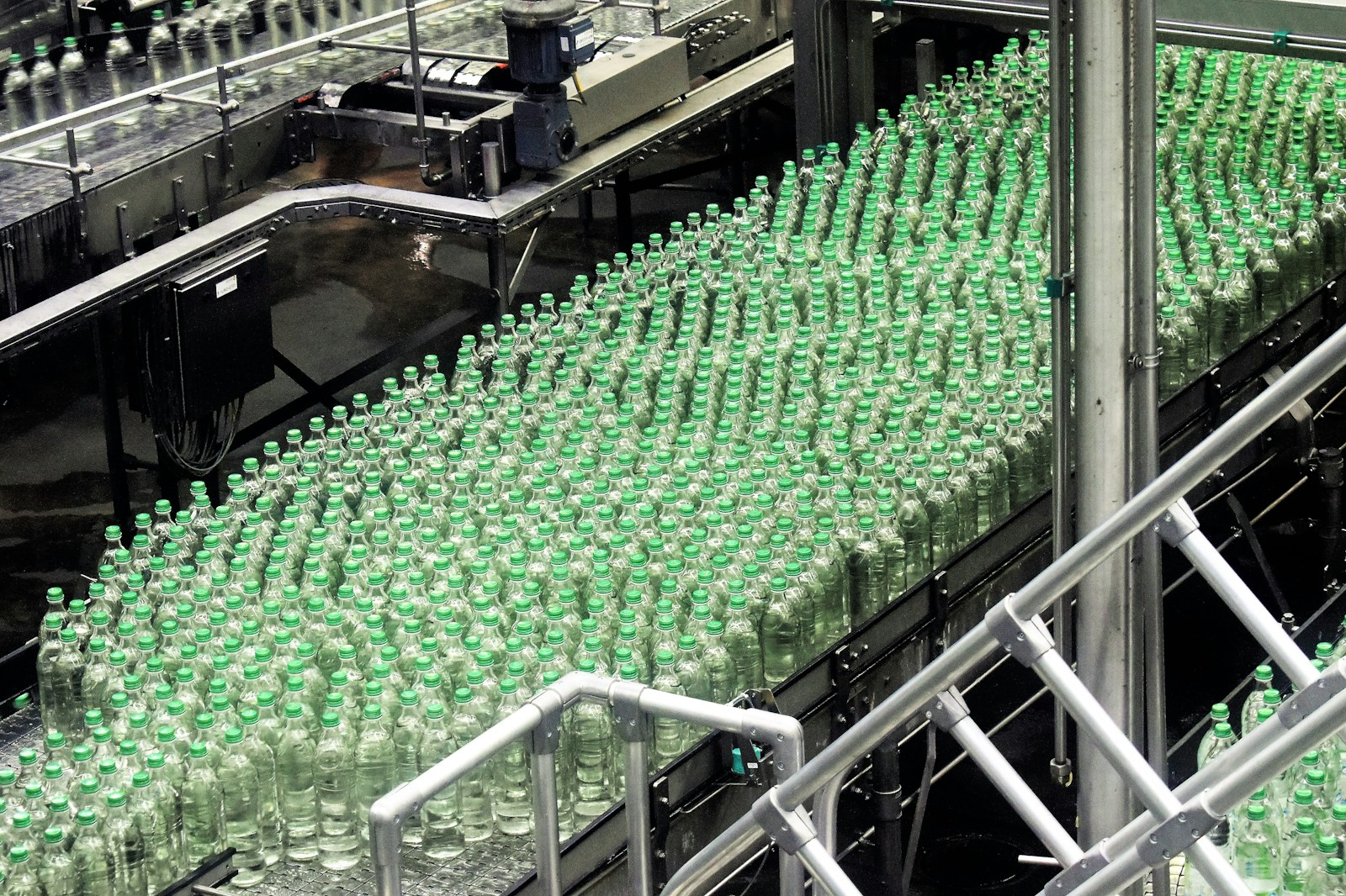 Glass bottles moving through a beverage production line